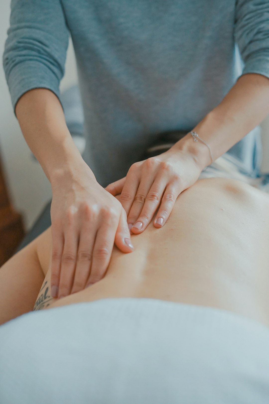 physio massaging woman's body